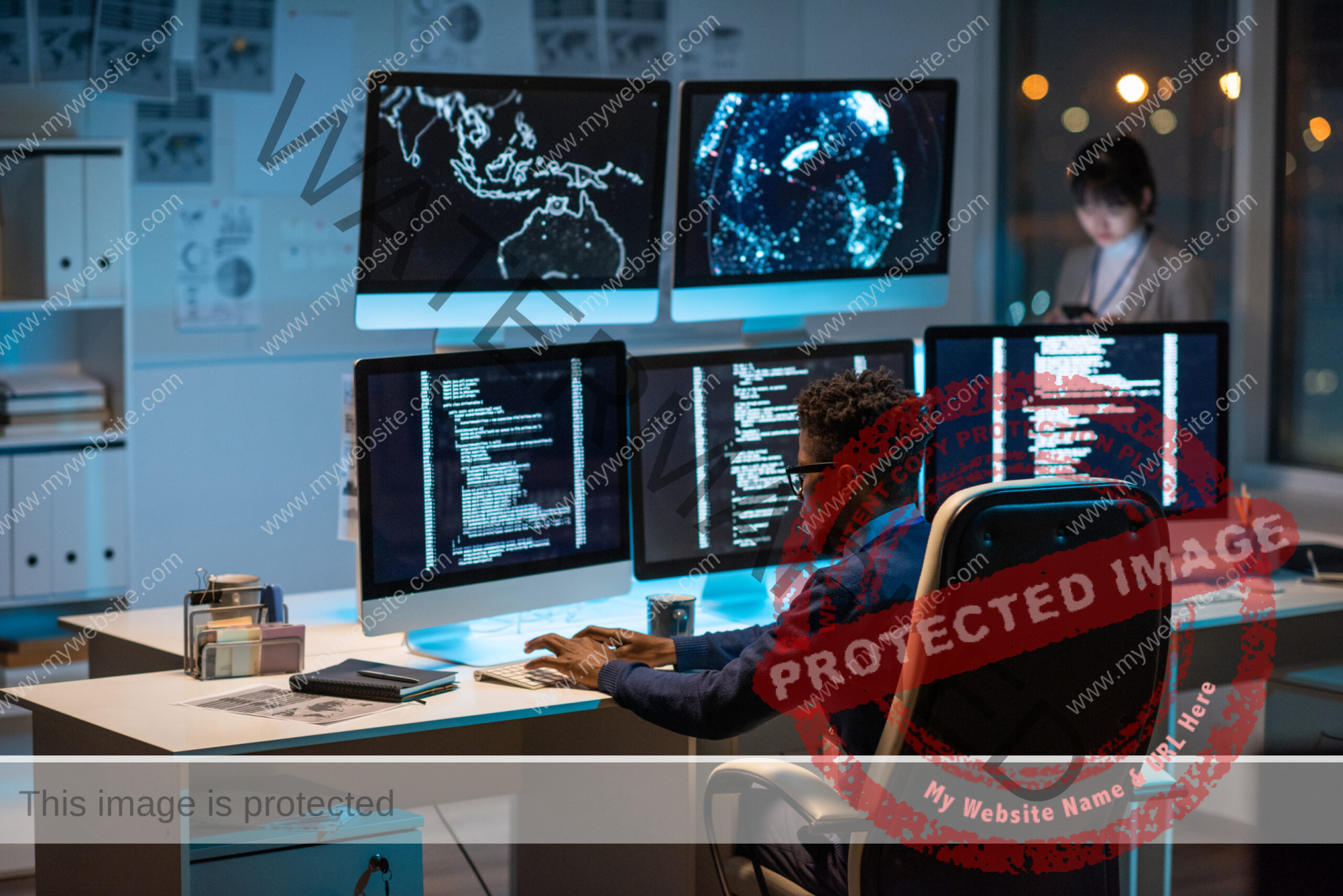 Young contemporary cyber security manager typing in front of computer